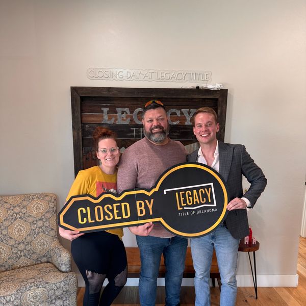 Closed by Legacy Title — Sam Redenius with clients at OKC closing