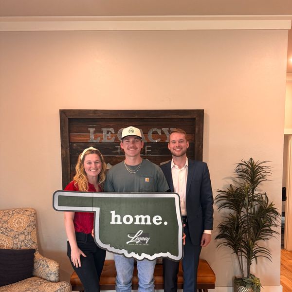 Oklahoma home closing — Sam Redenius with buyers at Legacy Title